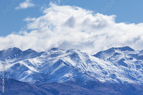 peak of mountain snow with white cloud and blue sky © stockphoto mania