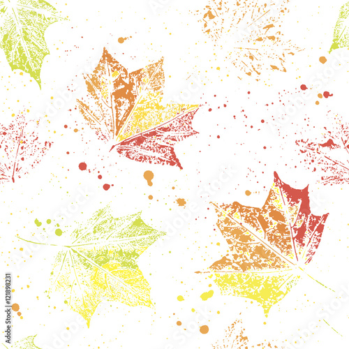 Seamless pattern of autumn maple leaves and splashes on a light background.  The pattern is suitable for decoration packaging paper and textiles.