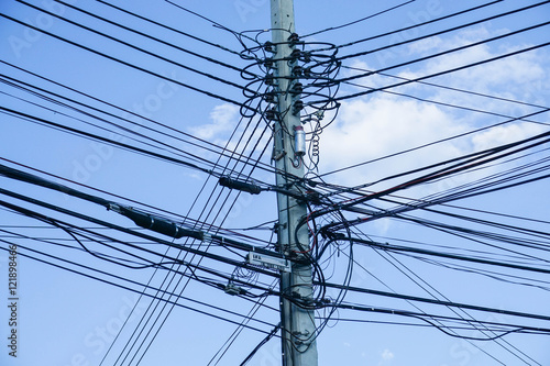 electricity pole with electricity wire in blue sky background