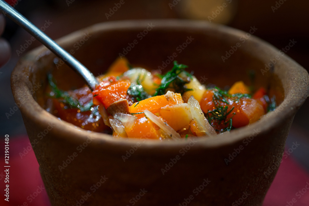 Hungarian national dish - bogracs, close up in bread plate