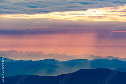 Sunset in the evening and mountain in background © narongchai