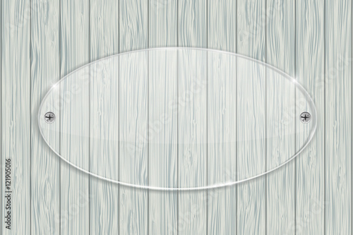 Transparent acrylic plate on wooden background