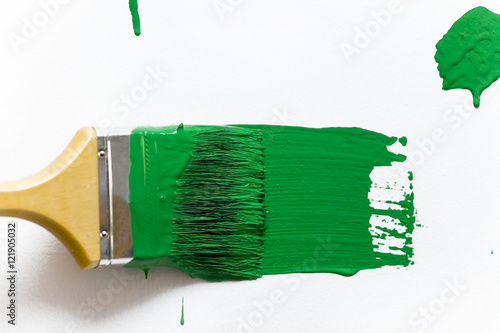 Green paint and brush
