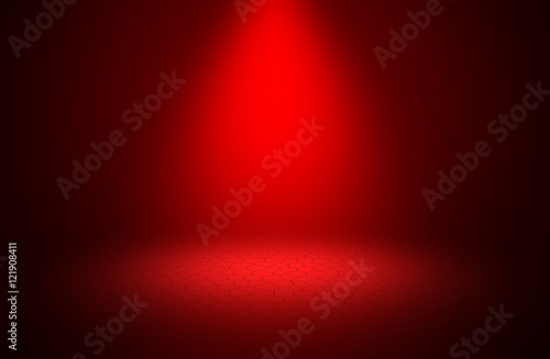 Spotlight red shines on stage brick floor design background.