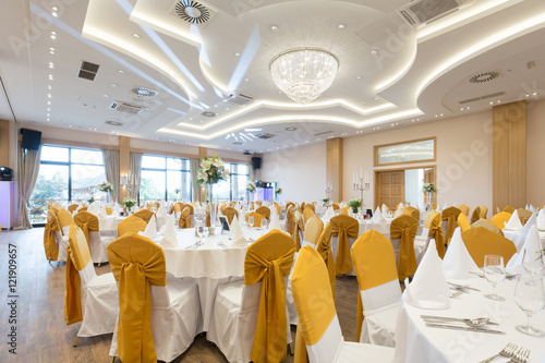 Wedding hall or other function facility set for fine dining photo