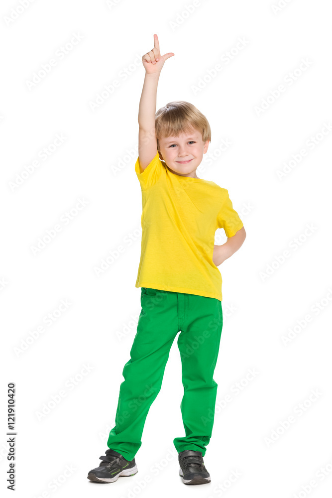 Smiling little boy shows his finger up Smiling little boy shows his finger up