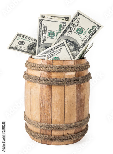 Wooden barrel with hundred dollar bills photo