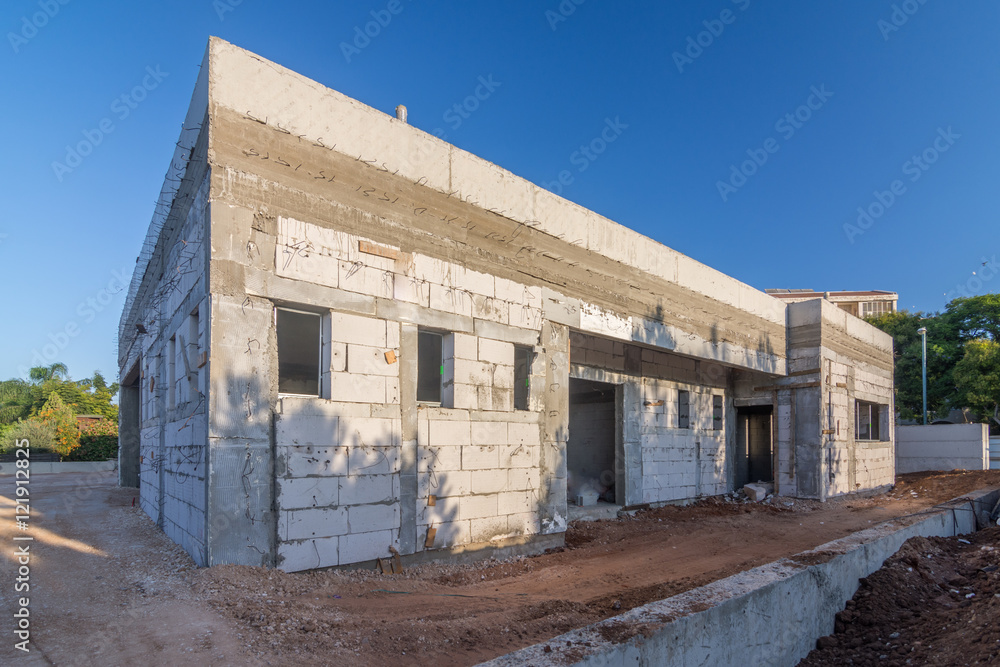 Brick and concrete house under construction