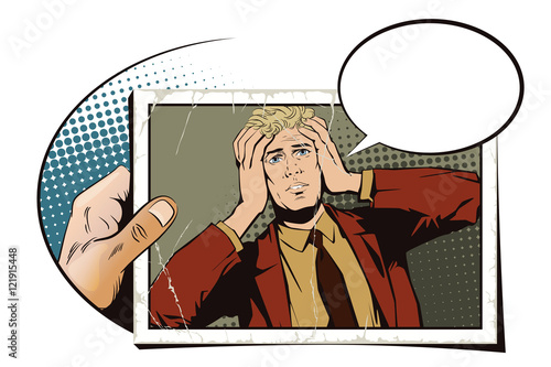 Hand with photo. Upset man clutching his head.