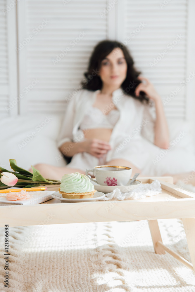 Woman having Breakfast in bed
