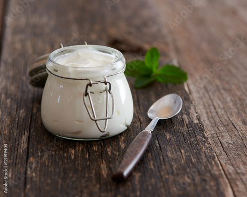 Greek yougurt on a wooden table photo