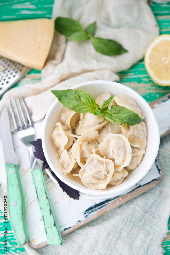 Plate of boiled pelmeni with cheese
Plate of boiled pelmeni with cheese