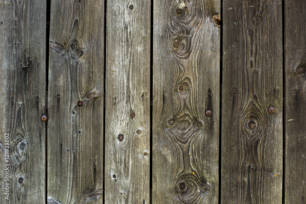 Grunge grey and brown weathered wood background. Horizontal photo of  vintage wood rustic door or fence. Grunge wooden weathered oak or pine  textured planks of aged grey and brown color. Stock Photo
