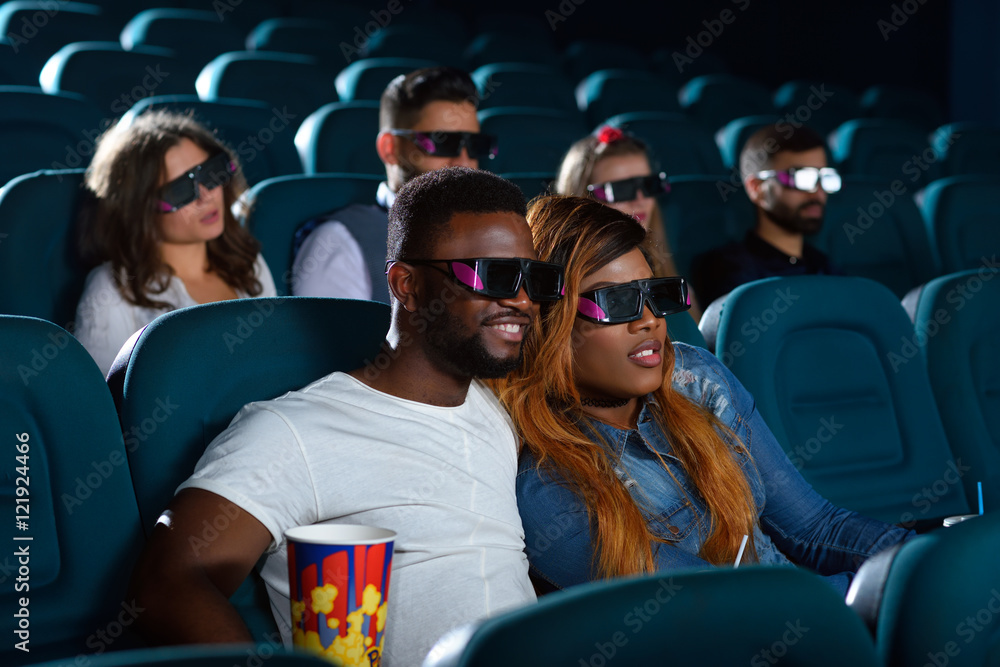 Obraz premium Happy African couple at the cinema