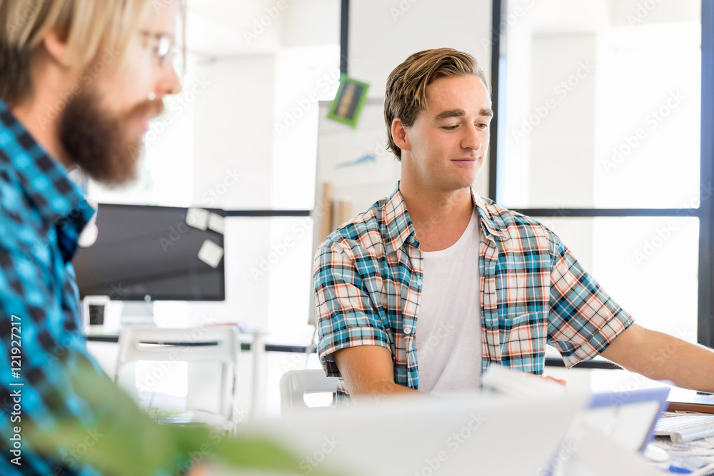 Two office workers at the desk Two office workers at the desk