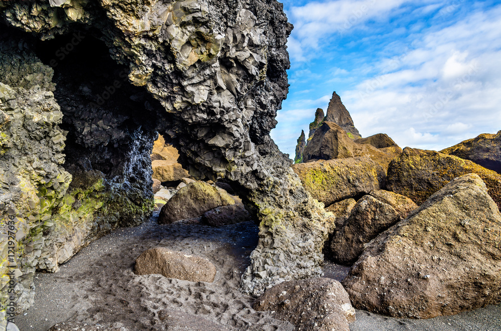 Natural basalt arch at Reynishofn beach - Iceland