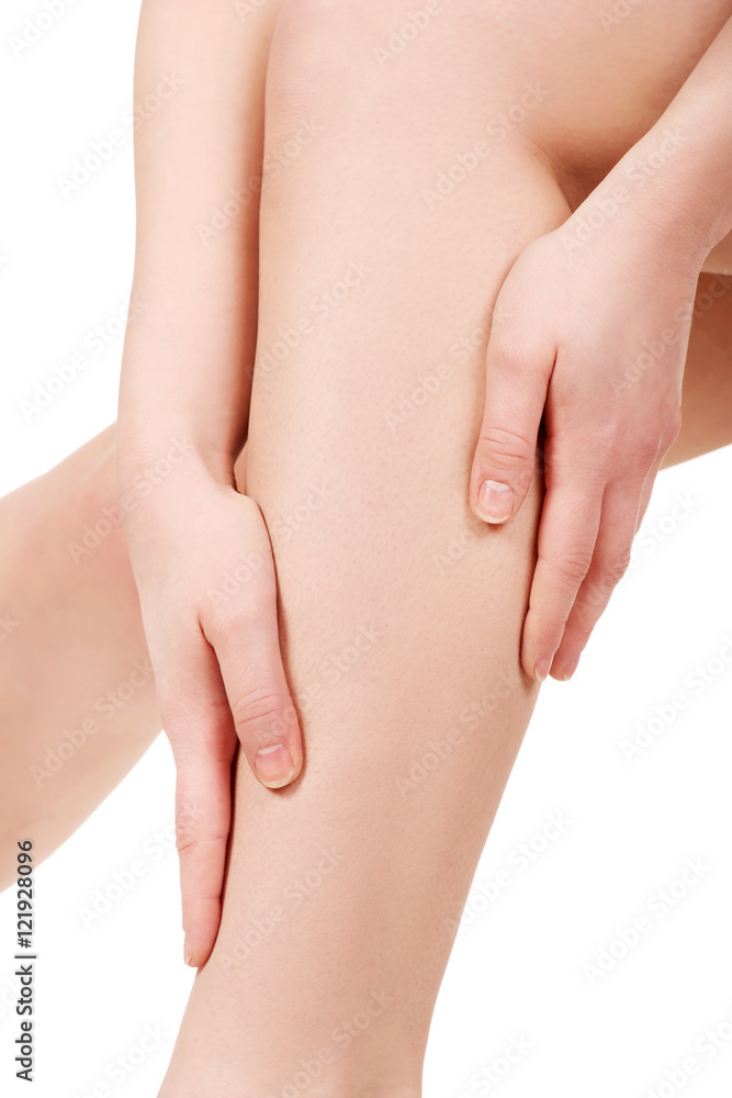 Woman massaging her leg.