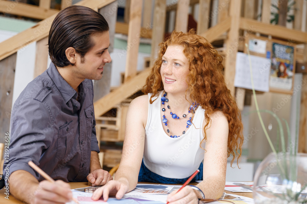 Obraz premium Two young architects in office