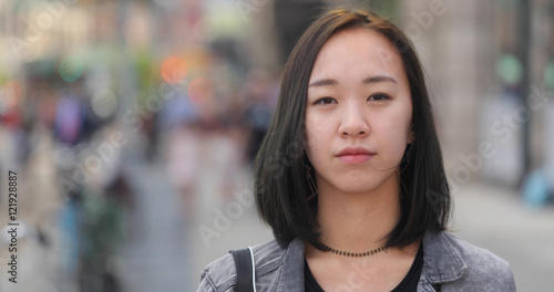 Obraz na plátně Young Asian woman in city face portrait