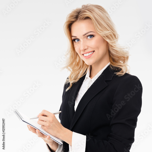 businesswoman with clipboard writing