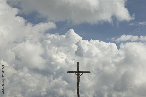 Religious cross in Heaven with clouds in the background