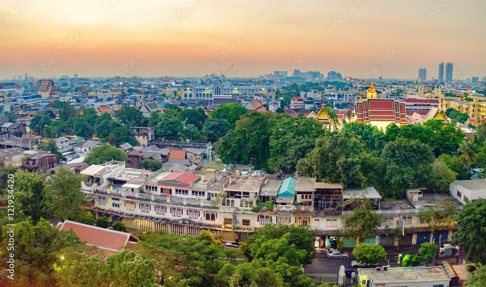 Traditional architecture of Bangkok from the height of bird flight. View of Wat Ratchanatdaram Temple from Golden Mountain at sunset, Thailand.