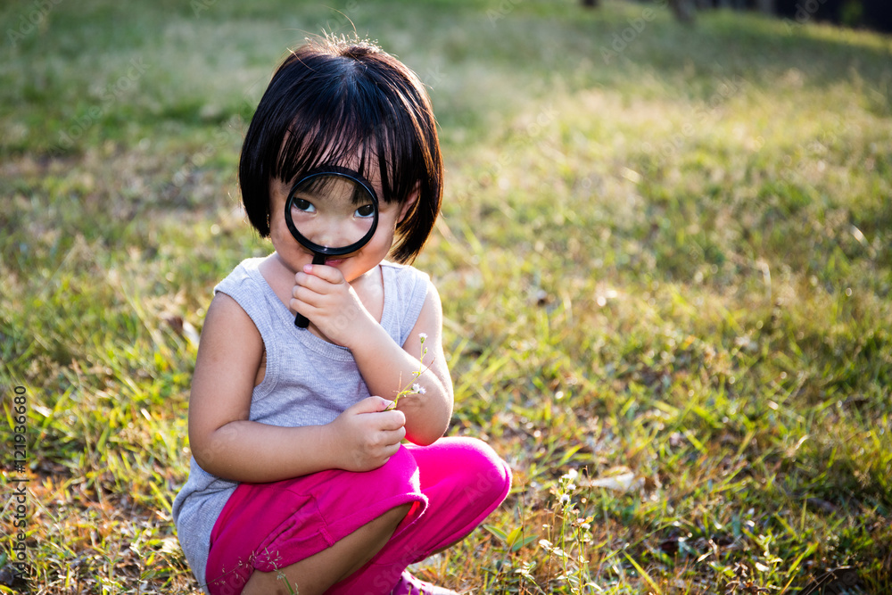 Asian Chinese Little Girl Exploring With Magnifying Glass Asian Chinese Little Girl Exploring With Magnifying Glass