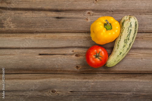 Vegetables on brown old planks wood table