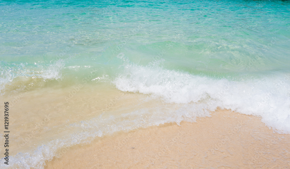 Sea waves and beautiful beach and white sand, with blue water Sea waves and beautiful beach and white sand, with blue water
