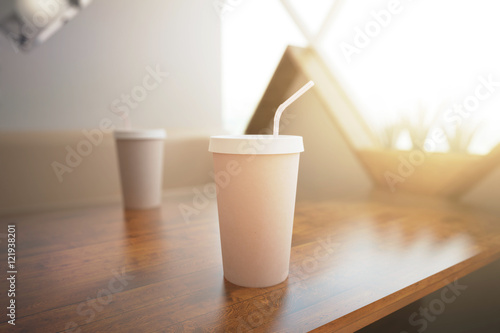 Coffee cup with straw