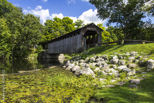 Fallasburg Covered Bridge. The historical Fallasburg covered bridge remains open to auto traffic and is located about 30 minutes from the city of Grand Rapids in Lowell Michigan. photo