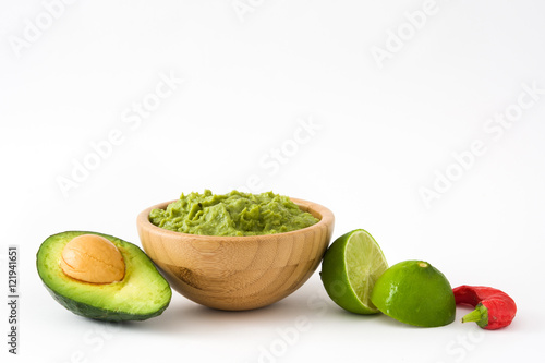 Nachos, guacamole and ingredients isolated on white background

 photo