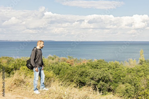 Beautiful sea landscape. A man looks at the sea.