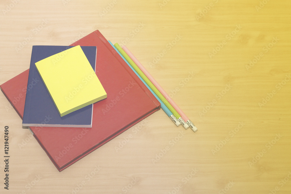 office desk with book, note and pencil on wooden desk office desk with book, note and pencil on wooden desk