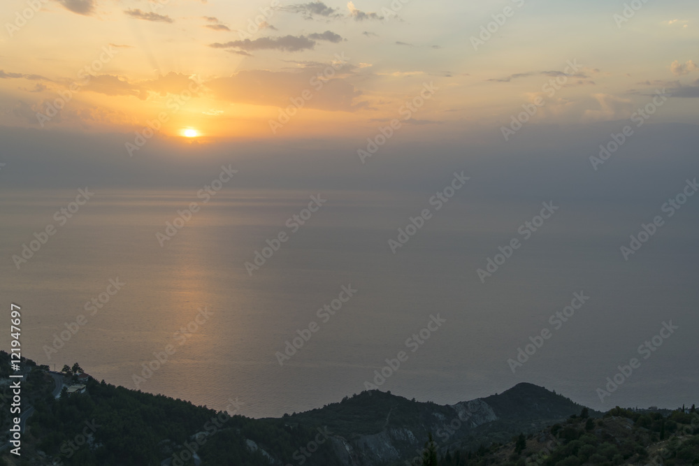 View from the top of the hill towards sea at sunset 2
