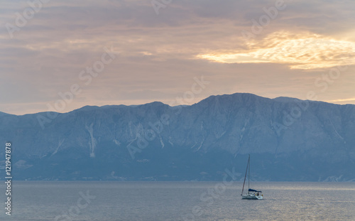 Boat at sea with mountains