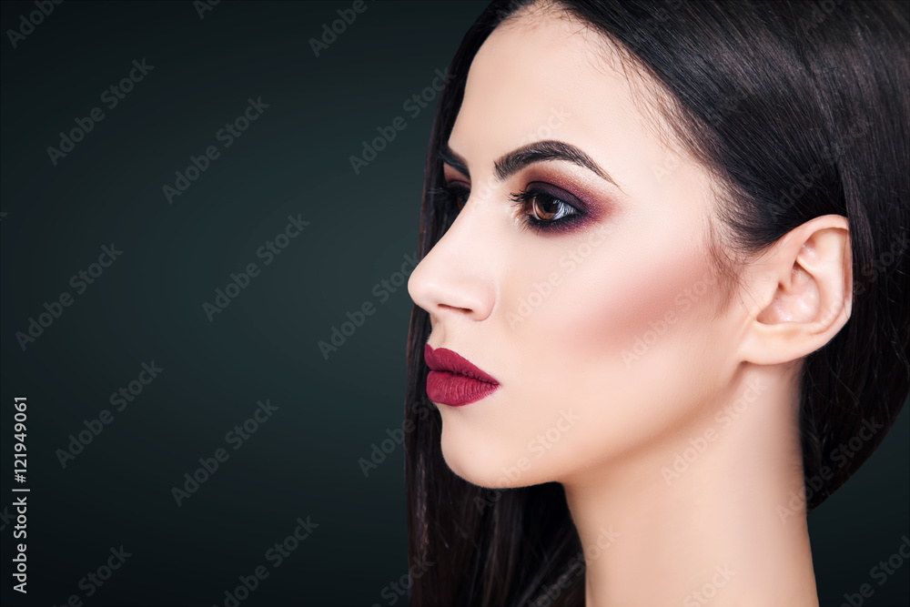 Naklejka premium The girl, a woman, a beautiful young girl with professional make