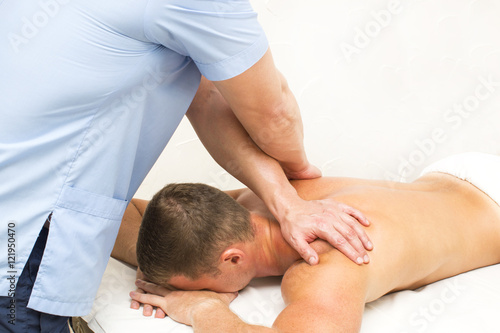 young man on wellness treatments sports massage