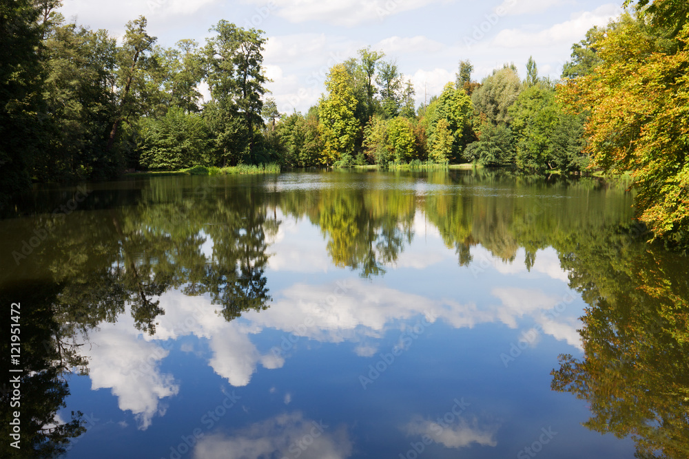 A scenic pond in the Arkadia park in Poland