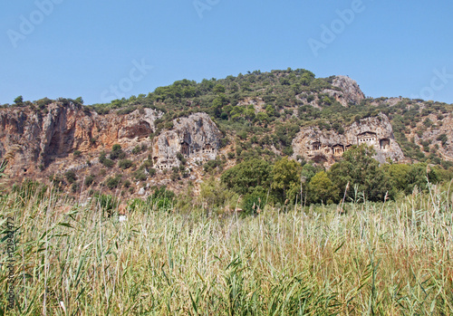 Tombs of the ancient Lycia rulers in rocks on the riverside Dalyan in Turkey