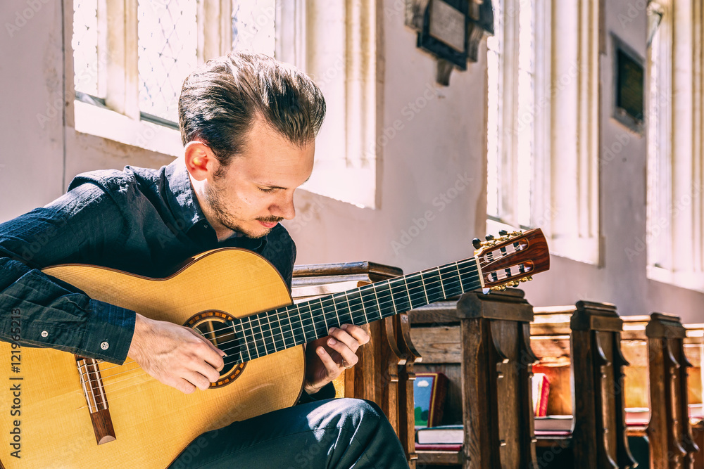 Fototapeta premium Young male classical guitarist