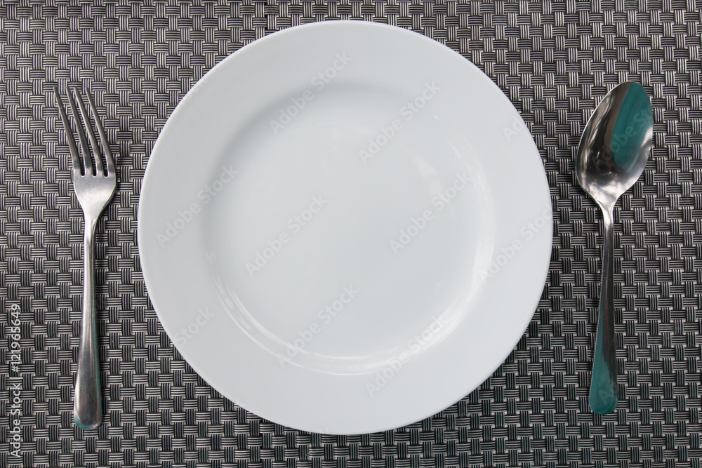 Empty dish with fork and spoon