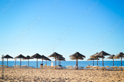 Fototapeta Naklejka Na Ścianę i Meble -  Beach ready for tourists. Golden sand with blue sky outdoors nature background