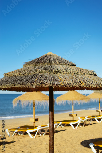 Beach ready for tourists. Golden sand with blue sky outdoors nature background