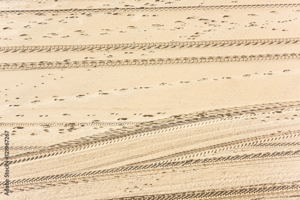 Traces of cars on the sand