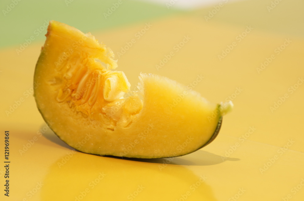 Yellow and ripe pumpkin lie on a bright background Yellow and ripe pumpkin lie on a bright background