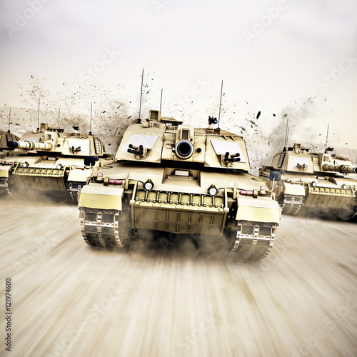 Фотография Military armored tank convoy moving at a high rate of speed with motion blur over sand