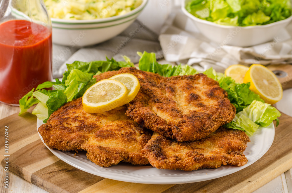 Delicious schnitzel with salad