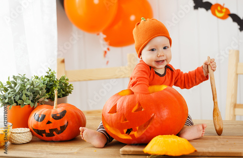 happy  baby with pumpkin for Halloween photo