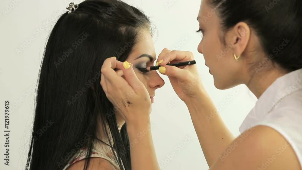 Make-up artist applying makeup Make-up artist applying makeup
